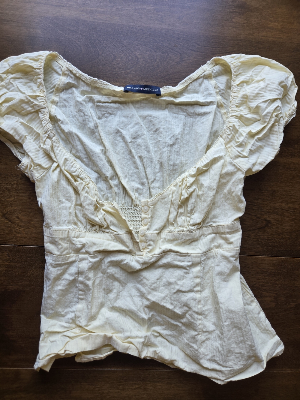 Brandy Melville Cream Peasant Top Ruched Puff Sleeve One Size
Description